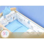Baby crib with blue bedding and bear-patterned bumper, Baby Life logo visible.