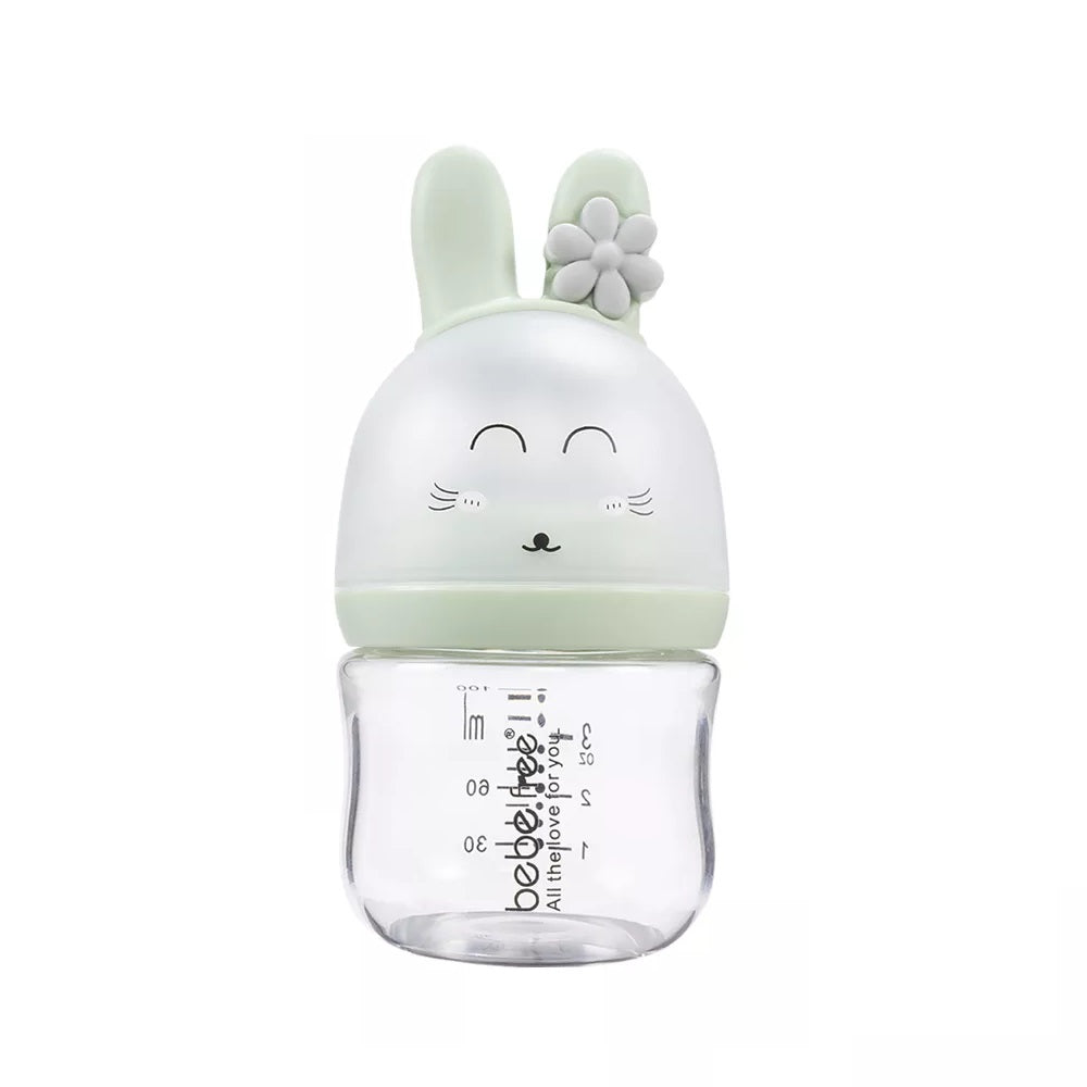 Clear bottle with a green bunny-shaped cap .