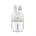 Clear bottle with a green bunny-shaped cap .