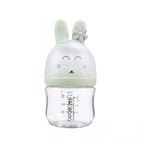 Clear bottle with a green bunny-shaped cap .