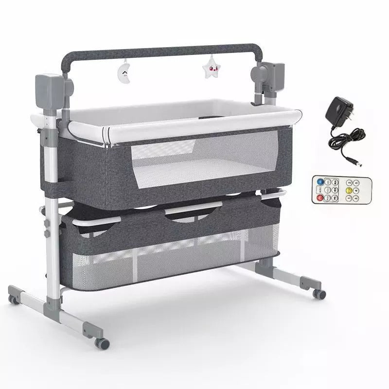 Baby crib with gray mesh side panels, white mattress, and remote control .
