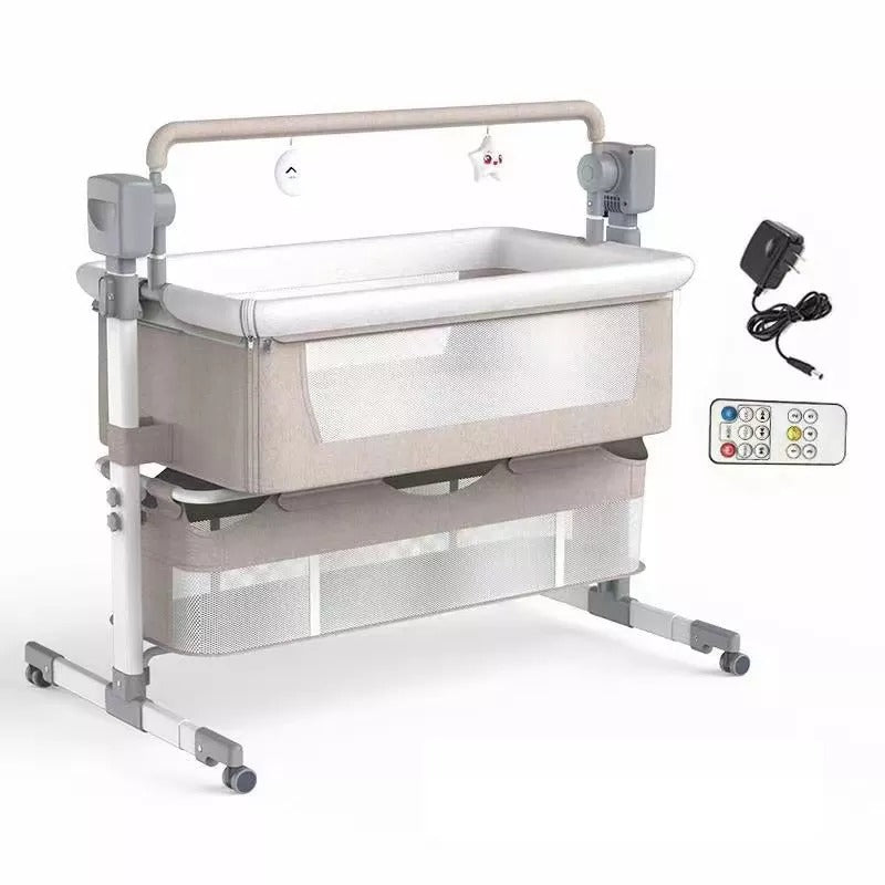 Baby crib with monitor, power adapter, and remote control.