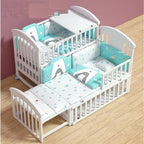 White crib with blue and white bedding 