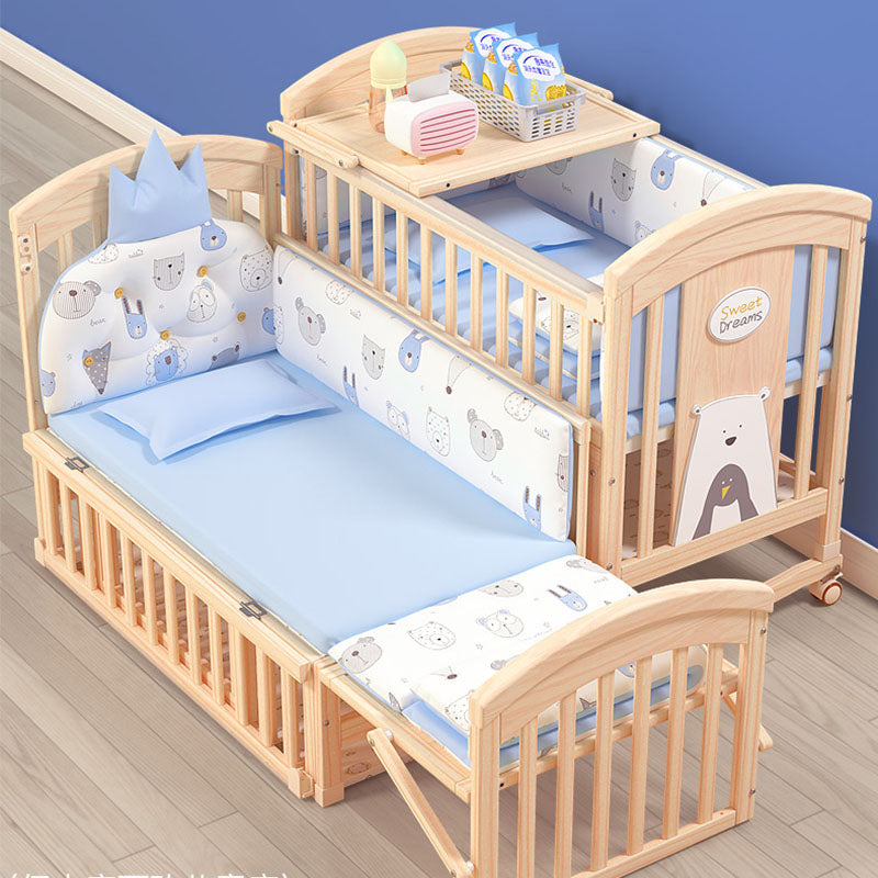 Wooden crib with baby bedding and accessories 