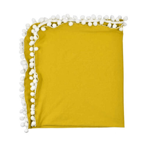 Yellow blanket with white pom-pom 