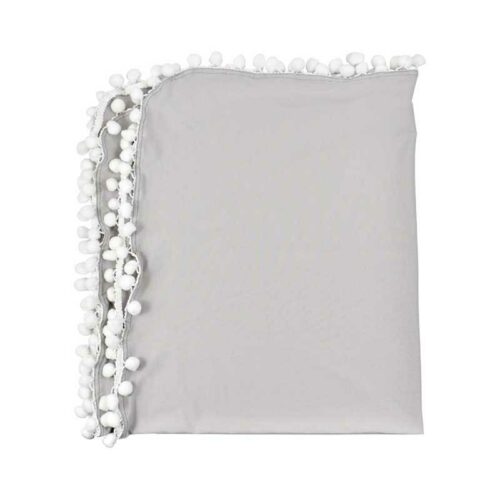 Gray pillow with white pom-pom trim 
