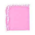 Pink blanket with white pom-pom trim .