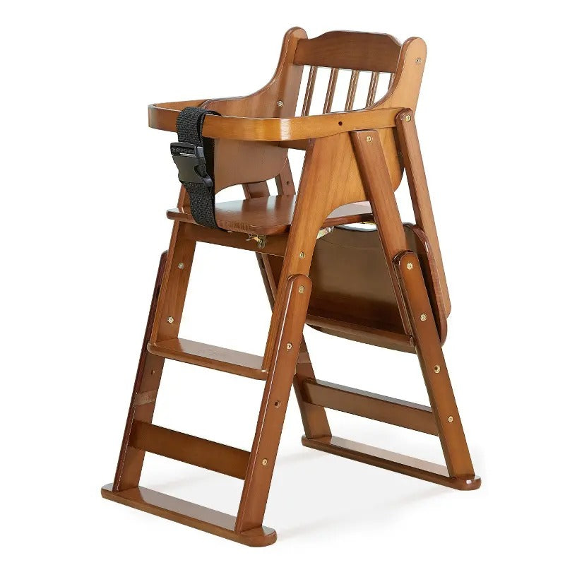 Wooden high chair with a black strap 