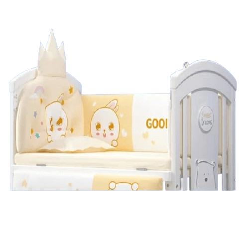 Children's crib with five piece bedding set of cartoon design.