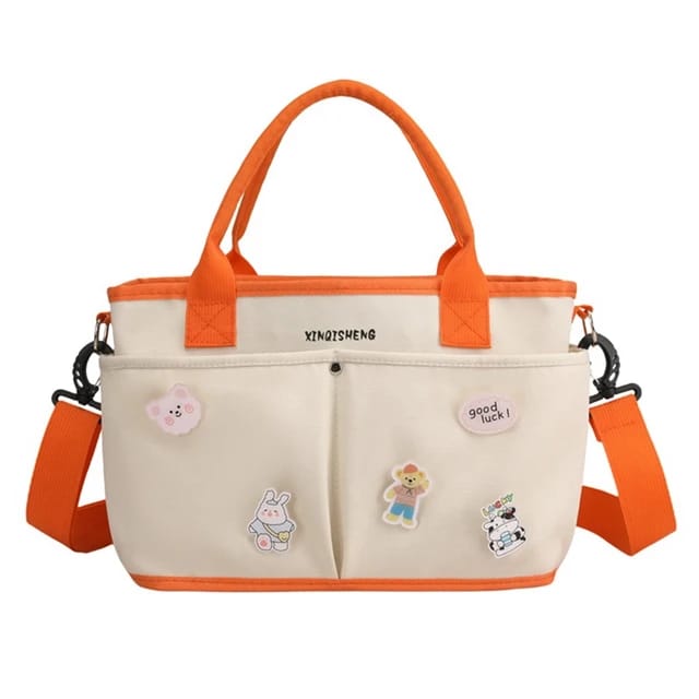 Beige and orange tote diaper bag with cartoon 