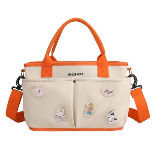 Beige and orange tote diaper bag with cartoon 