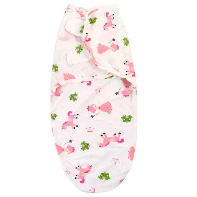 Baby swaddle with pink dog pattern .