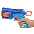 Blue and orange toy gun held in a hand.