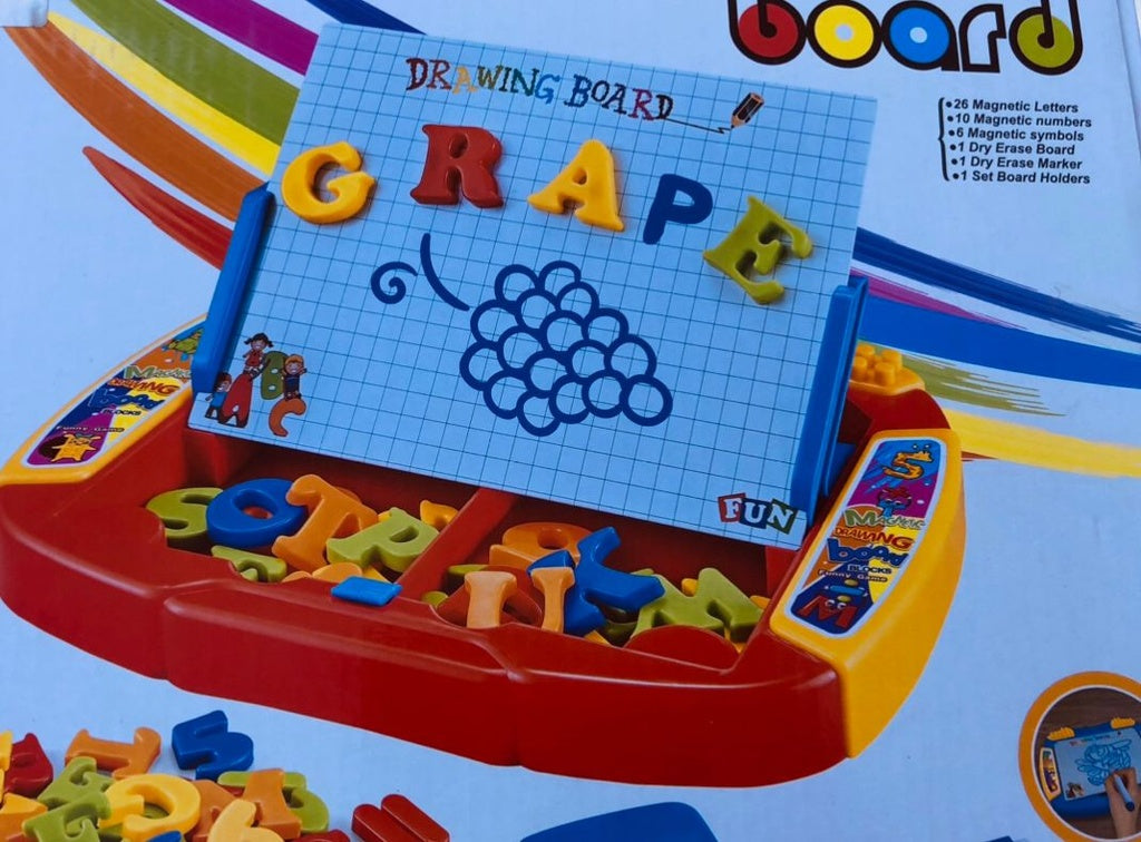 Toy drawing board with magnetic letters and numbers .