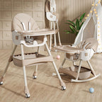 Two baby high chairs on a wooden floor with a plant and decorative lights 