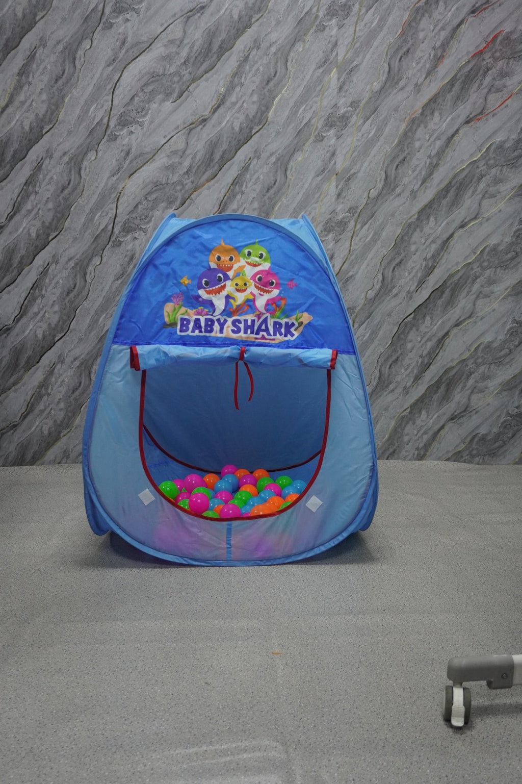 Blue 'Baby Shark' play tent with colorful balls.