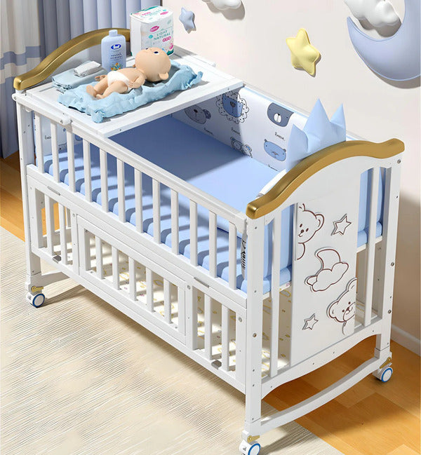 White baby crib with blue bedding 