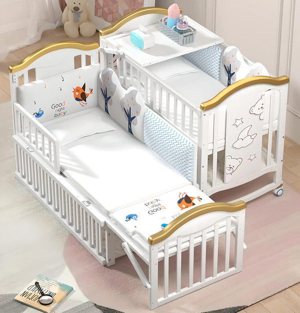 White crib with gold accents 