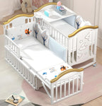 White crib with gold accents 