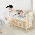 Woman adjusting a wooden crib with a baby inside, in a bright room.