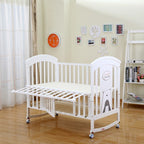 White crib in a room 