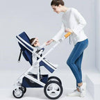 Woman pushing a blue and white belecco stroller with a child inside 