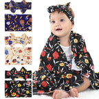 Baby wearing a floral headband and scarf with additional patterns displayed.