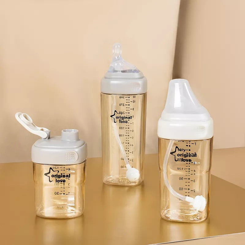 Three baby breast milk  bottles with white caps .