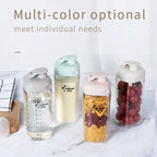 Set of four colorful breast milk  bottles 