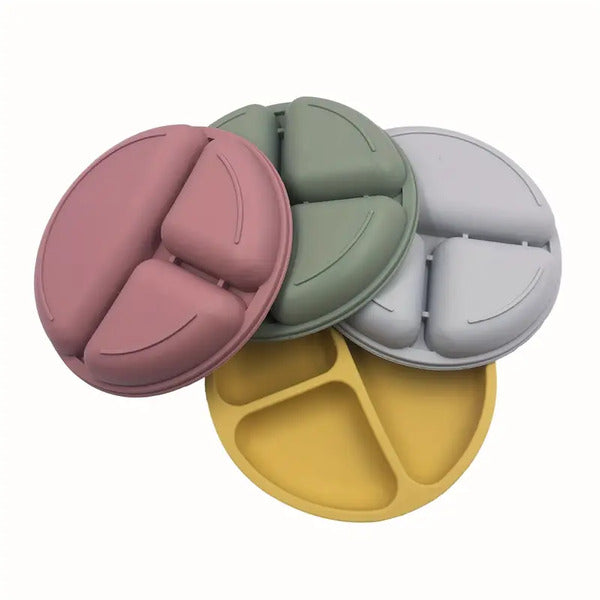 Set of colorful silicone snack plates .