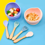 Colorful children's bowls and utensils 