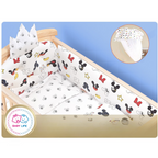 Baby crib with Mickey Mouse-themed bedding set .