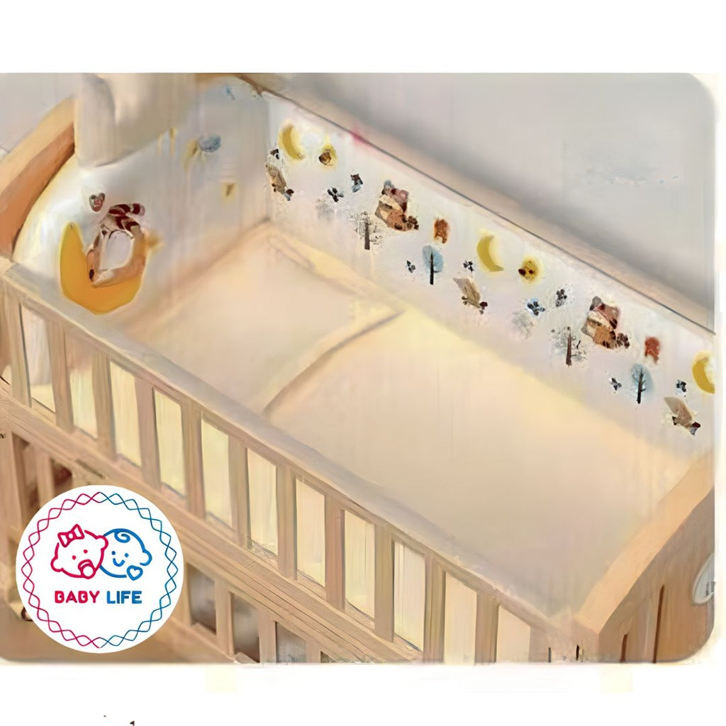 Baby crib with a five piece bedding decorative bumper and 'Baby Life' logo.
