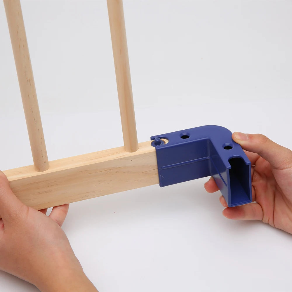 Blue corner connector being used on wooden frames.