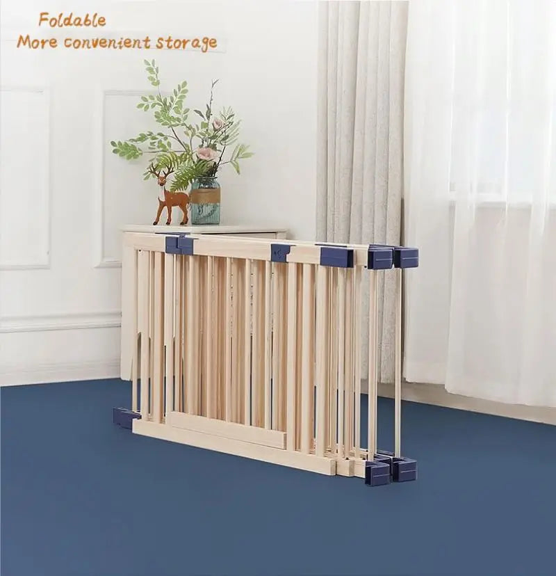 Wooden pet gate with blue accents in a room with white walls and blue floor.