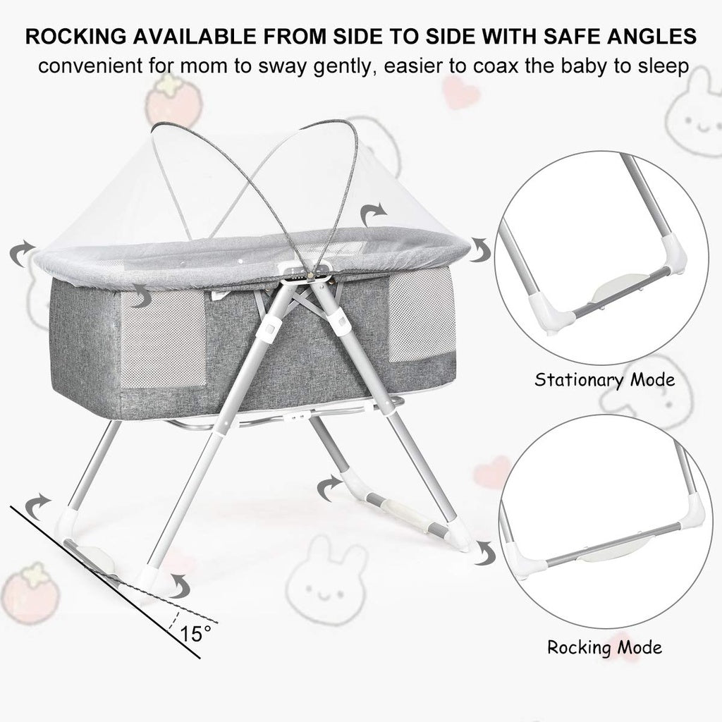Baby bassinet with rocking feature and safety angles .