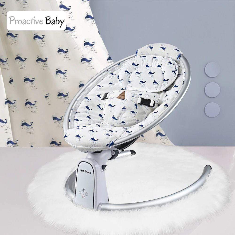 Electric Baby swing with whale pattern fabric.