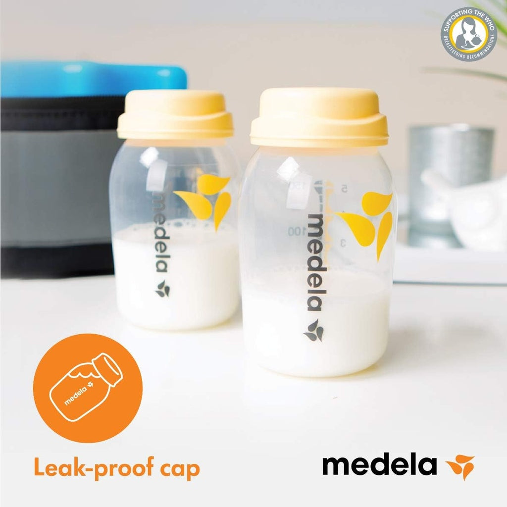 Two Medela bottles with yellow caps .