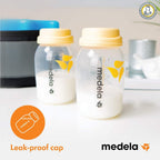 Two Medela bottles with yellow caps .