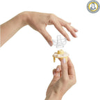 Hand holding a small plastic nipple
