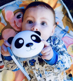 Baby holding a panda melii snack box .
