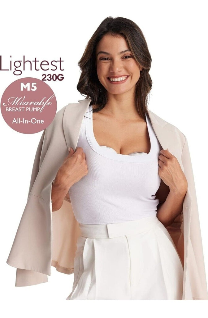 Woman wearing a beige cardigan over a white top with text about a breast pump .