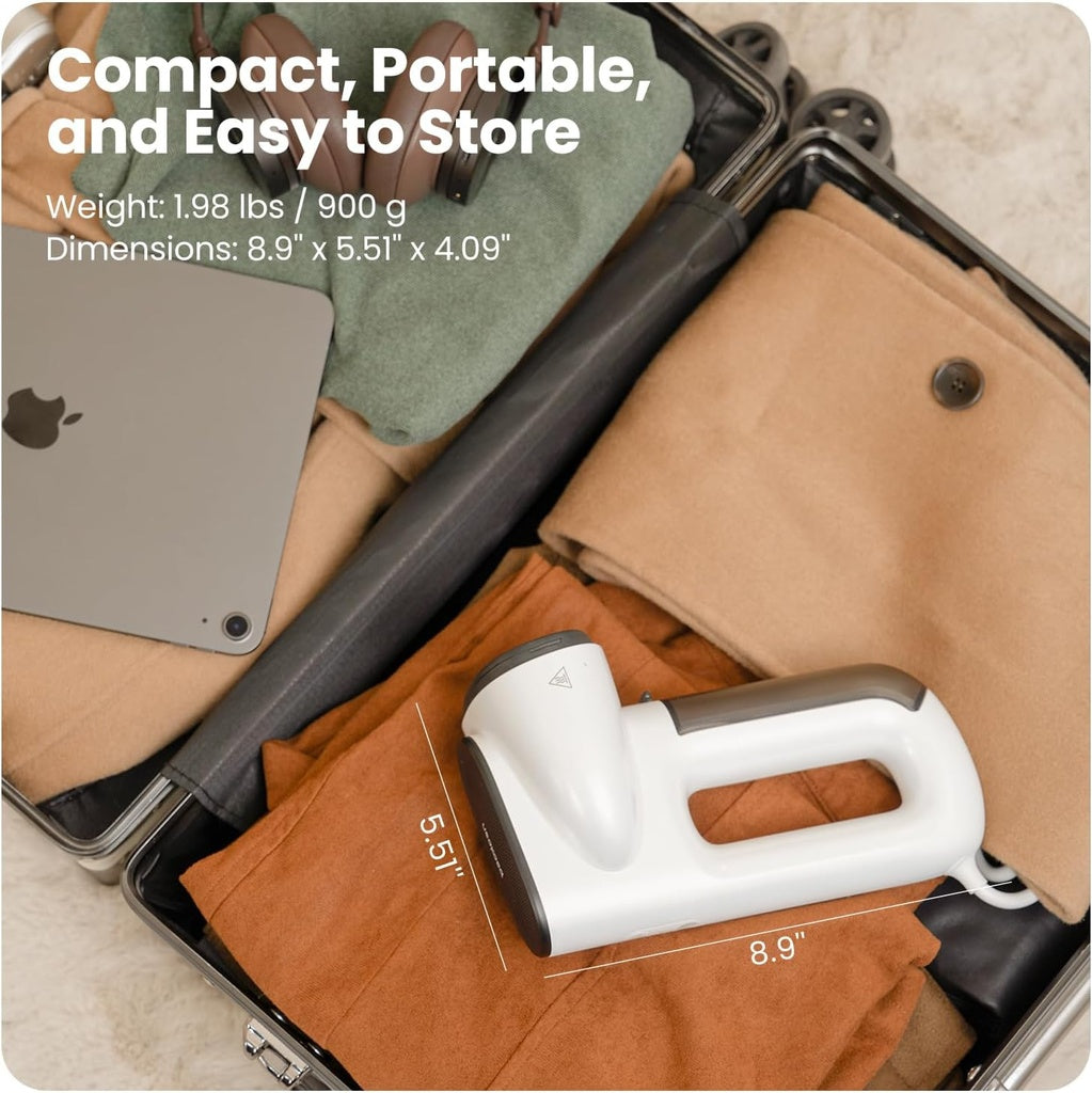 Compact suitcase with clothes and a device, highlighting portability and ease of storage.