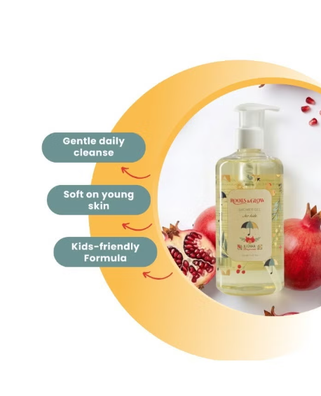 Bottle of Roots &Glow skincare product with pomegranate elements .