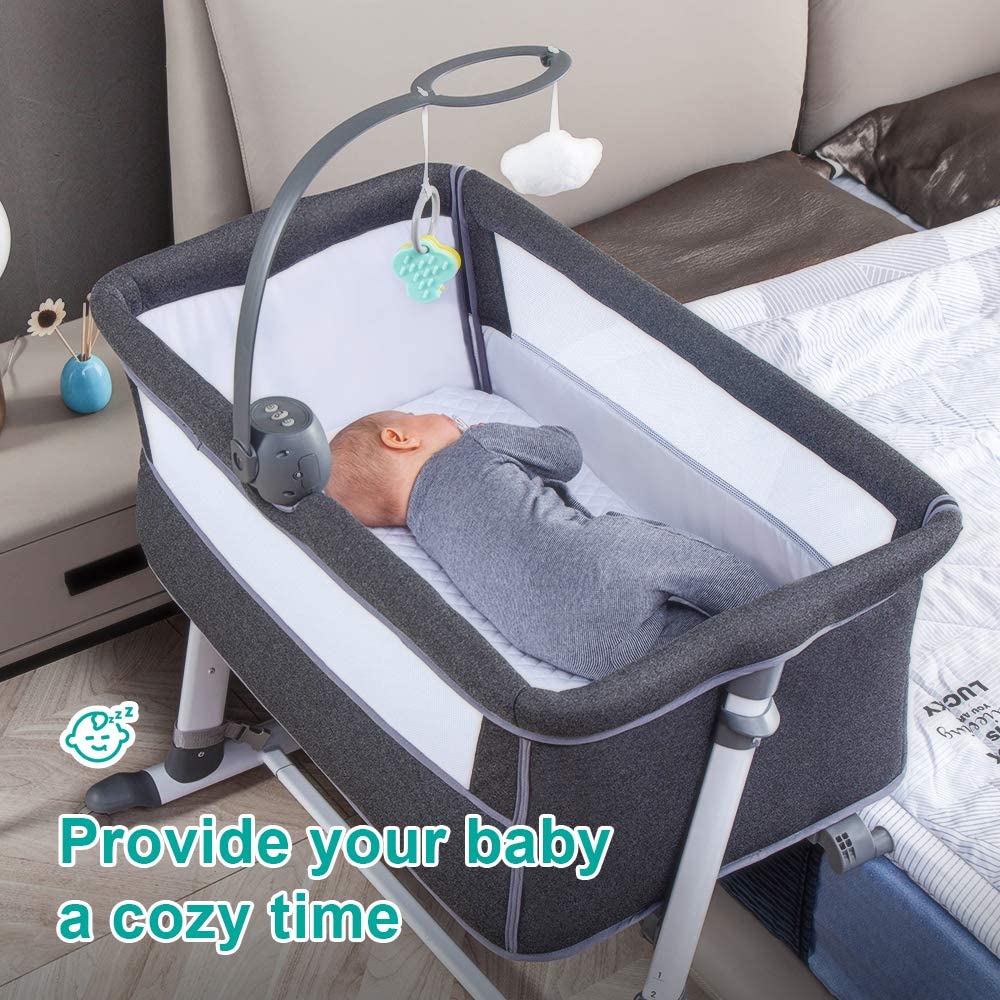 Baby in a  new born gray bassinet with a cozy atmosphere