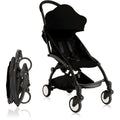 Black stroller with folded umbrella 