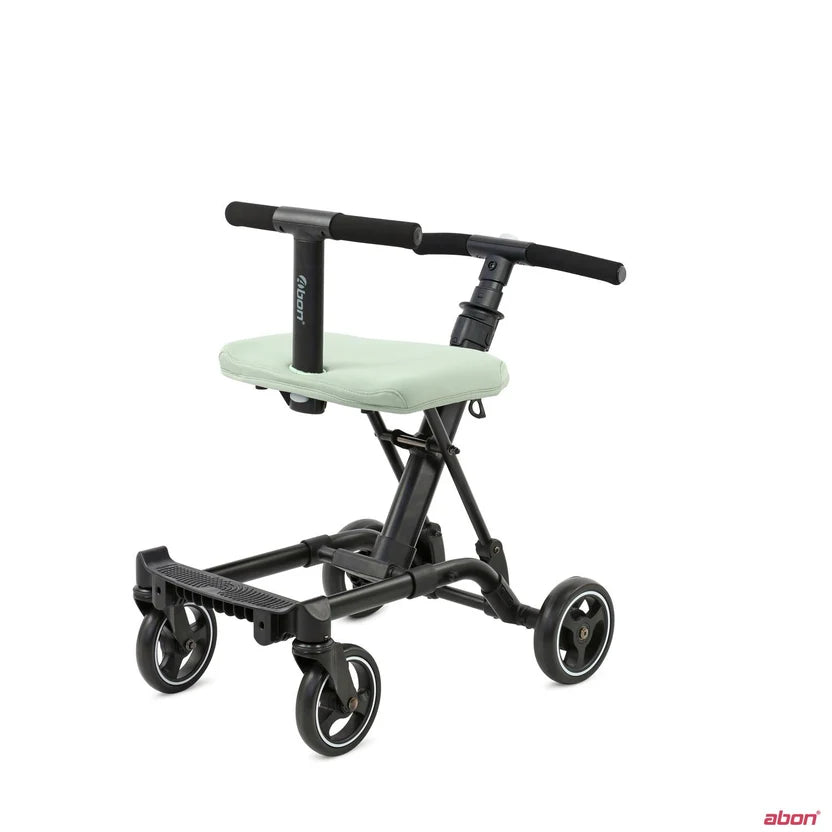A black convertible rider l mobility scooter with a light sage green padded seat, shown from a three-quarter angle .