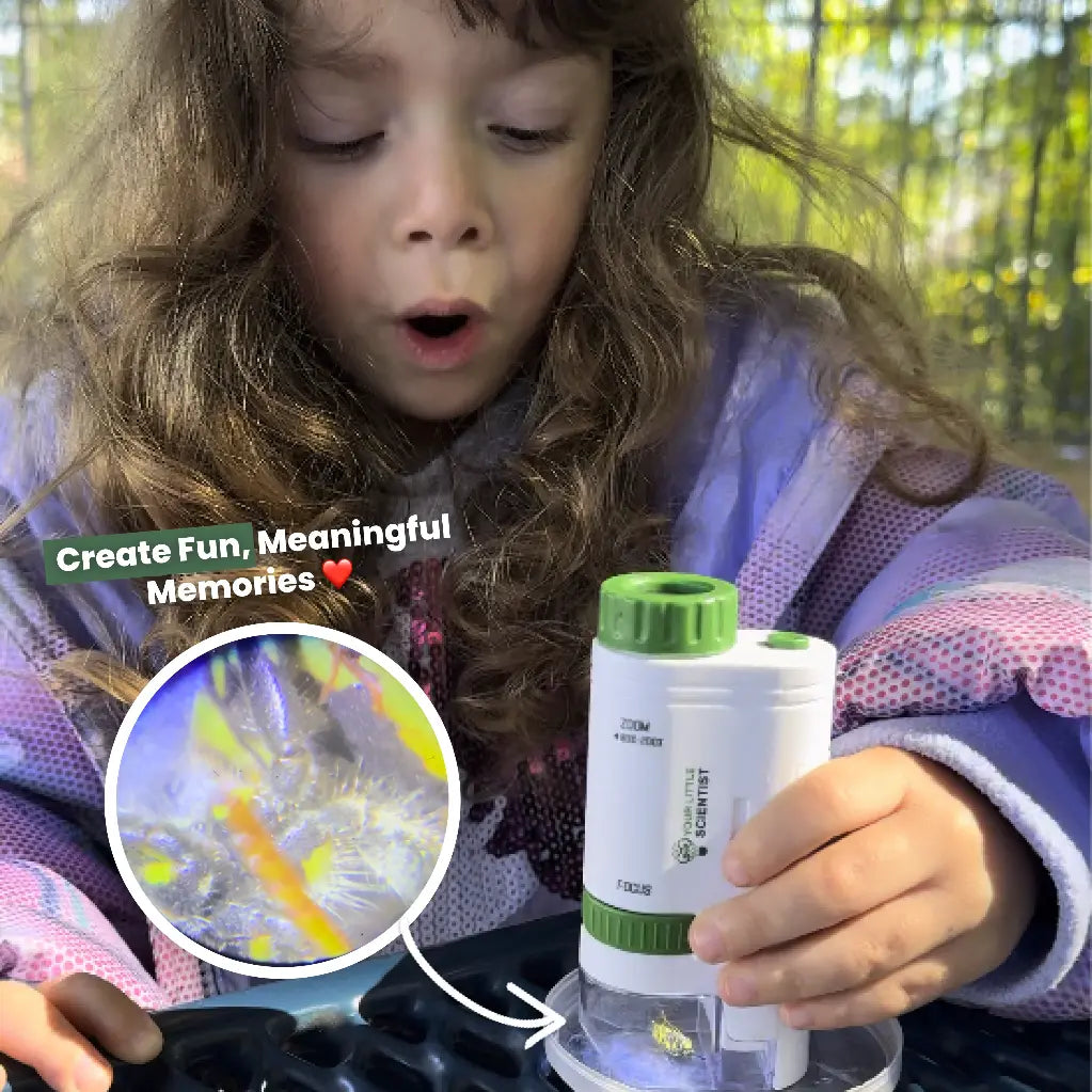 Child holding a white and green Miniscope with colorful liquid inside.