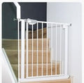 Baybee White metal safety gate on a wooden staircase ..